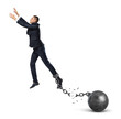 © gearstd - A businessman leaping away from an attached iron ball with a broken chain.