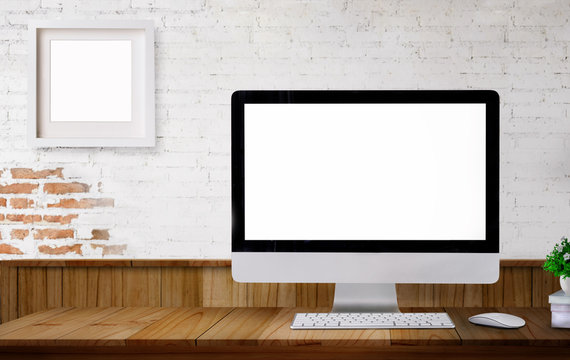 workspace desktop computer on wood table. copy space and blank screen for products or graphics montage.