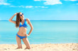 © Africa Studio - Beautiful young woman in bikini near sea on summer day