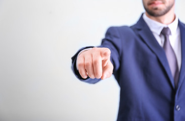 Sticker - Young businessman using virtual screen, on light background