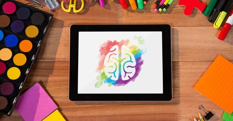 Poster - Tablet on a school table with colored brain on screen