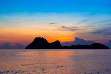 Wall Mural - bright colors at dawn on the beach at sunrise in the gulf of thailand.