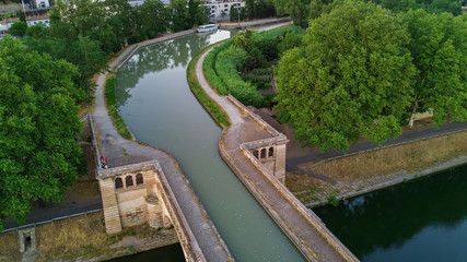 Wall Mural - Aerial top view of river, canal du Midi and bridges from above, Beziers town, South France
