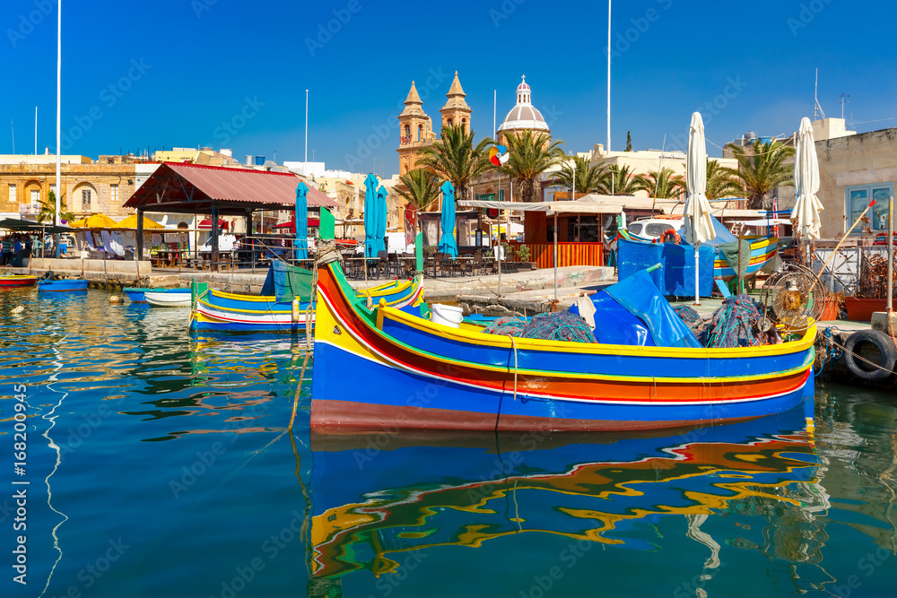 Traditional eyed colorful boats Luzzu in the Harbor of Mediterranean fishing village Marsaxlokk, Malta - obrazy, fototapety, plakaty 