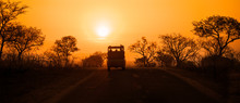Safari Vehicle At Sunset