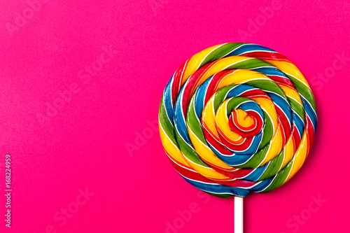 Tasty appetizing Party Accessory Sweet Swirl Candy Lollypop on Pink Background T Poster Mural XXL