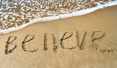 Wall Mural - A word to believe on the beach