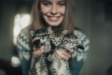 Caucasian Woman Holding Kittens