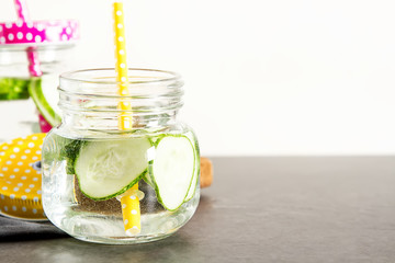 Wall Mural - Refreshing cucumber cocktail, lemonade, detox water in a glasses.