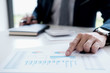 © MIND AND I - Attractive meeting at nonprofit boardroom group of employees at conference table workers collaborate in discussion