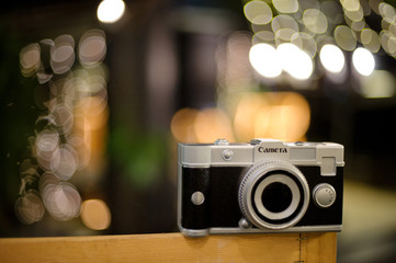 Wall Mural - camera with bokeh background / vintage color