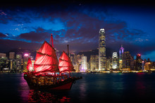 Victoria Harbour Hong Kong Night View With Junk Ship On Foreground
