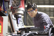 © Blue Jean Images - Confident engineer working in the factory