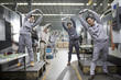 © Blue Jean Images - Engineers stretching in the factory