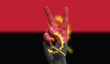 angola national flag painted onto a male hand showing a victory, peace, strength sign