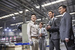 © Blue Jean Images - Business people and engineer in the factory