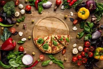 Wall Mural - pizza slices on wooden board