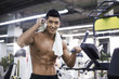 © Blue Jean Images - Young man resting at gym