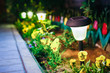 Solar Garden Light, Lanterns In Flower Bed. Garden Solar Powered