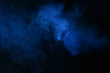 Abstract blue smoke on a dark background