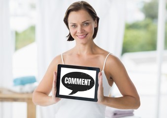 Wall Mural - Comment text and chat graphic on tablet screen with hands