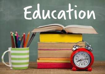 Poster - Books on Desk foreground with blackboard Education text