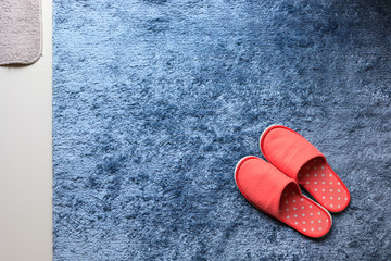 Wall Mural - red slipper shoe on blue carpet floor softness mat