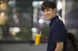 © Blue Jean Images - Happy young man holding a cup of juice