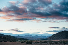 Mountainous Desert Landscape At Sunset