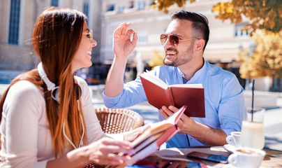 Dating. Young couple drinking coffee in the cafe. Education, relationships, love, lifestyle concept