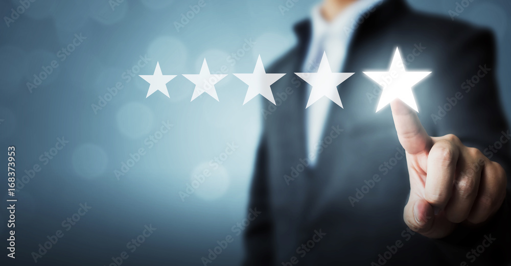 Businessman pointing five star symbol to increase rating of company - obrazy, fototapety, plakaty 
