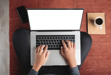 Aufkleber -  top view person using laptop computer on sofa inside home