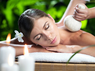 portrait of young beautiful woman in spa environment.  