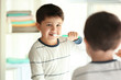 © Africa Studio - Cute little boy cleaning teeth at home