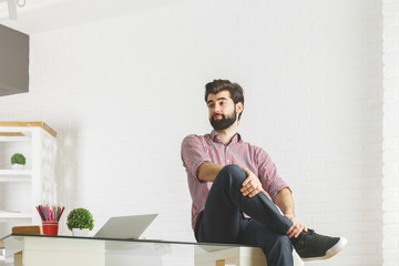 Canvas Print - Man sitting on office desk