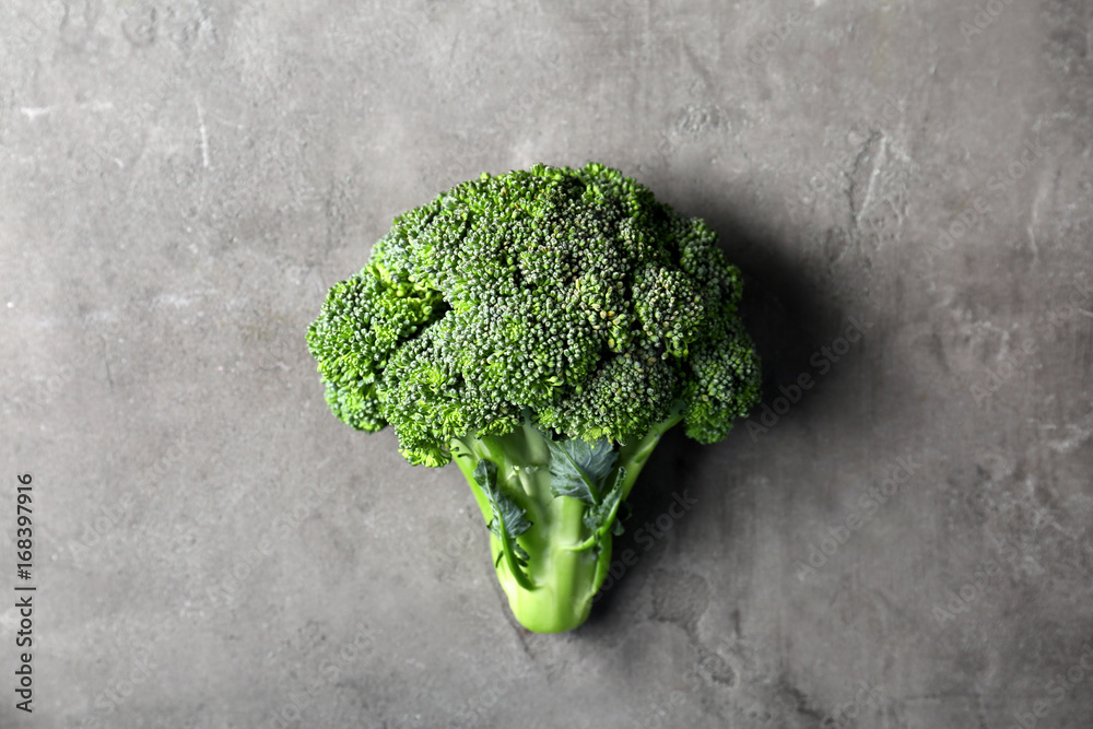 Fresh green broccoli on grey background