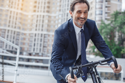 Fotografie, Obraz Senior business man with a bicycle outdoors