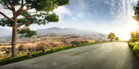 Village hills nature landscape. road in motion bluring sunny day