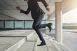 © Flamingo Images - Running up fast man wearing suit