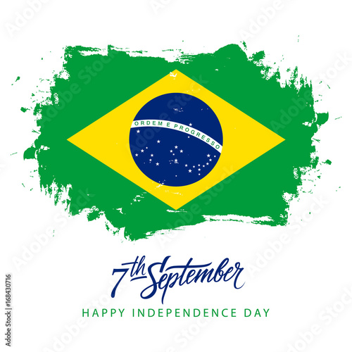 Foto Brazil Independence Day, 7 september greeting card with hand lettering and brazilian national flag brush stroke background