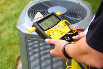 air conditioning repair servicing man