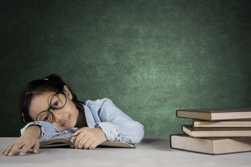 Nerdy girl resting in the classroom