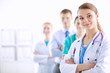 © lenets_tan - Attractive female doctor in front of medical group
