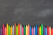 colored crayons on the blackboard