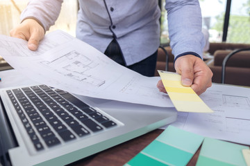 Poster - interior Creative creativity graphic designer working with graphics laptop, blueprint and colour chart at workplace on wooden desk , colour ideas style concept