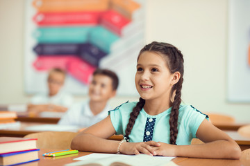 Wall Mural - Happy clever children learning in classroom