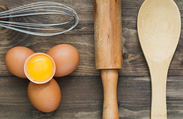 Wall Mural - Top view on fresh eggs and kitchen utensil. Cooking concept.