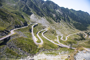 View of the mountain road Transfagarashan, also known as Ceaushescu's Folly which cross the Fagarash ridge in the Carpathian Mountains in Romania. The most beautiful mountain road in Europe. 