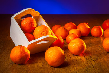 Wall Mural - Tangerines ruffled on the table.