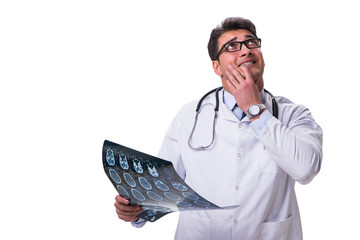 Young male doctor holding a radiograph isolated on white backgro